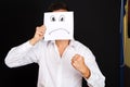 Man holding card with a angry face Royalty Free Stock Photo