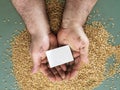 Man holding card and seeds, farmer