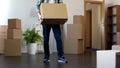 Man holding cardboard box, moving to new flat or leaving apartment, relocation Royalty Free Stock Photo