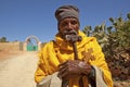 A man holding a carved cross, Ethiopia