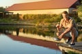 Man holding caught fish at lake Royalty Free Stock Photo