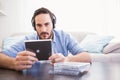 Man holding cd while listening to music