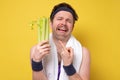 Man holding celery crying. I hate vegetables but should eat for healthy diet. Royalty Free Stock Photo