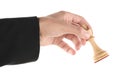 Man holding chess king on white background, closeup. Competition concept Royalty Free Stock Photo
