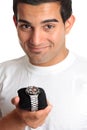 Man holding a chronograph wrist watch