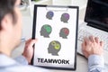 Teamwork concept on a clipboard Royalty Free Stock Photo