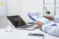 Man holding clipboard with two blue graphs Royalty Free Stock Photo