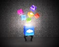 Man holding cloud box illuminated app icons with brick wall Royalty Free Stock Photo