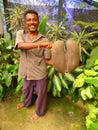 Man holding a coco-de-mer Royalty Free Stock Photo