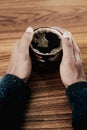 Man holding coffee on a table 4