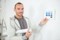 Man holding color swatch and pointing Royalty Free Stock Photo