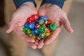 Man Holding Colorful Polyhedral Dice Playing Dungeons and Dragons Royalty Free Stock Photo