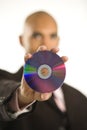 Man holding compact disc. Royalty Free Stock Photo