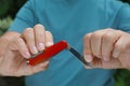 Man holding compact portable multitool, closeup view Royalty Free Stock Photo