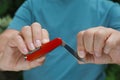 Man holding compact portable multitool, closeup view