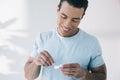 Man holding container for lens and trying to take contact lens Royalty Free Stock Photo