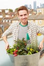 Man Holding Container Of Plants On Rooftop Garden Royalty Free Stock Photo