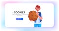 man holding cookie protection of personal information internet web pop up we use cookies policy notification