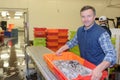 Man holding crate fish