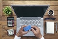 Man holding credit card and using laptop computer. Online Shopping Concept Royalty Free Stock Photo