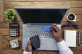 Man holding credit card and using laptop computer. Online Shopping Concept Royalty Free Stock Photo