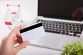 Man holding credit card and using laptop. Online shopping concept Royalty Free Stock Photo