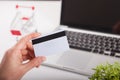 Man holding credit card and using laptop. Online shopping concept Royalty Free Stock Photo
