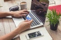 Man holding credit card and using laptop. Online shopping Royalty Free Stock Photo