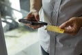 Man holding credit card and using smartphone at home, businessman shopping online, e-commerce, internet banking Royalty Free Stock Photo