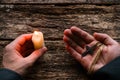 Man holding a cross and a candle on table Royalty Free Stock Photo