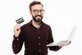 Man holding debit card and laptop computer. Royalty Free Stock Photo