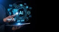 Artificial intelligence concept with digital interface and man holding tablet symbolizing technological advancement Royalty Free Stock Photo