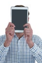 Man holding digital tablet in front of his face Royalty Free Stock Photo