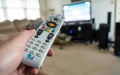 Man holding DirecTV remote