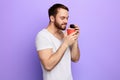 Man holding disposable plastic cup with coffee and enjoys the aroma Royalty Free Stock Photo