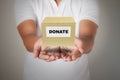 Man holding donate box