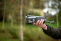 Man holding a drone with his hand before flying it through the sky Royalty Free Stock Photo