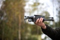 Man holding a drone with his hand before flying it through the sky Royalty Free Stock Photo