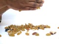 Man Holding and dropping from distance of Mixed Dry fruits isolated on white background