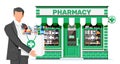 Man holding drugstore bag in front of pharmacy