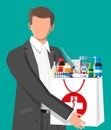 Man holding drugstore bag