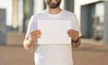 Man holding empty signboard at international airport