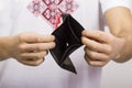 Man holding an empty wallet Royalty Free Stock Photo