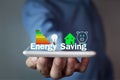 Man holding Energy Saving concept. Royalty Free Stock Photo