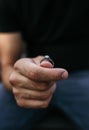 Man holding an engagement ring in his hand Royalty Free Stock Photo