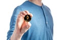 Man holding an Ether Ethereum coin on a white background