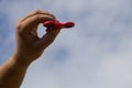 Man holding fidget spinner stress relieving toy Royalty Free Stock Photo