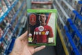 Man holding Fifa 18 with Russia World Cup 2018 cover videogame on Microsoft XBOX One