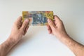 Man holding fifty Australian Dollar in his hands Royalty Free Stock Photo