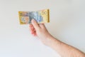 Man holding fifty Australian Dollar in his hands Royalty Free Stock Photo